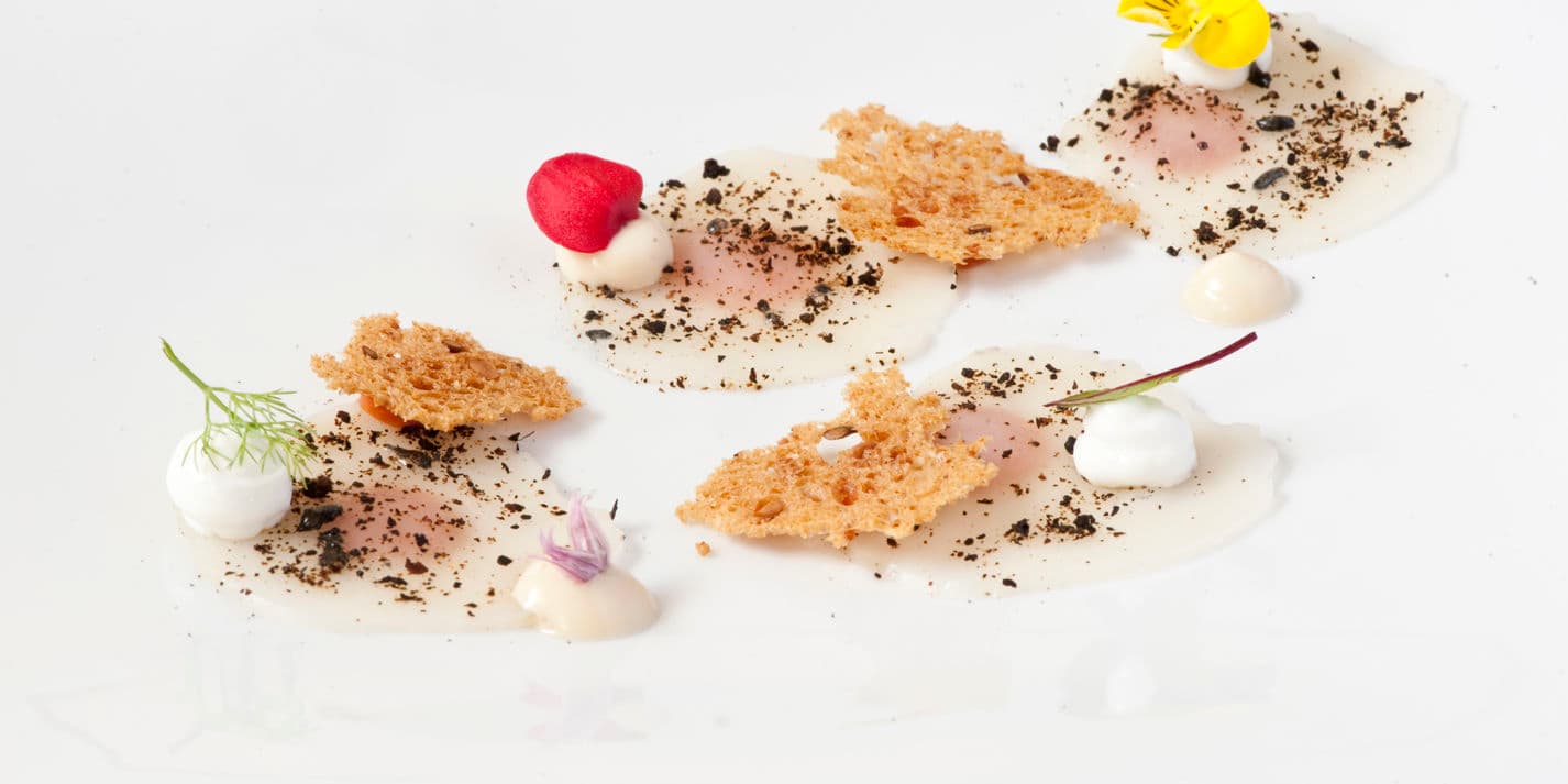 Raw scallops, three sauces and black lemon