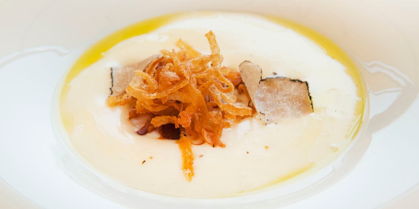 Potato foam with eggs, pancetta, crispy onions and truffle