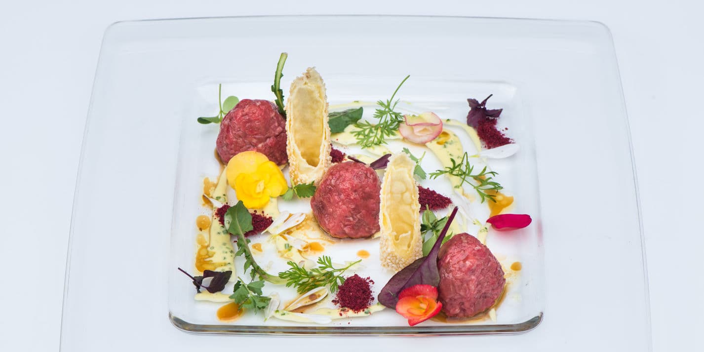 Beef tartare with sesame cannelloni and olive oil and chive sauce